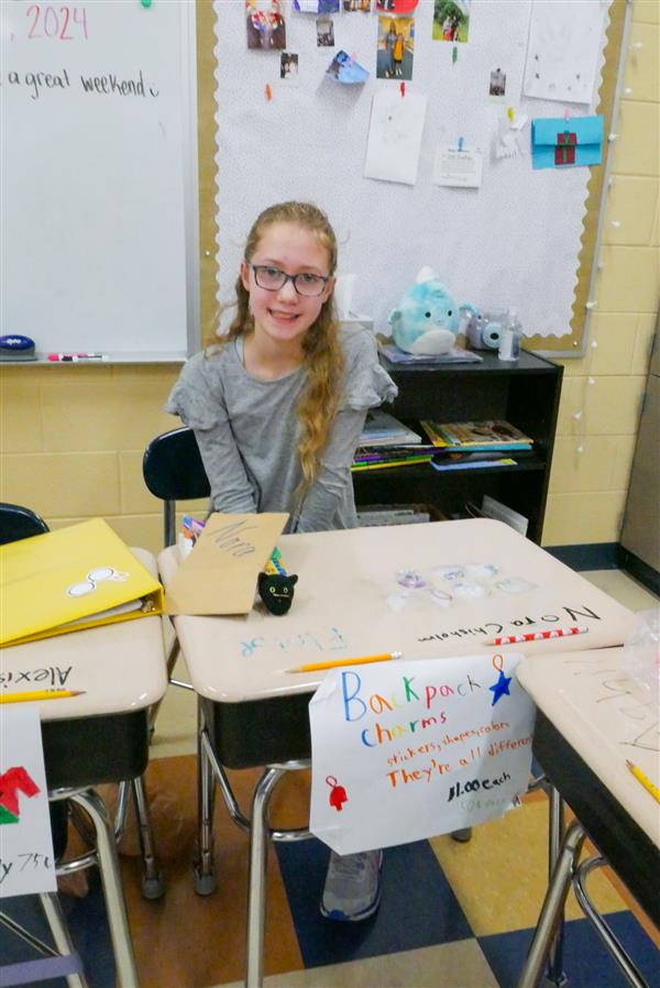 girl selling backpack charms